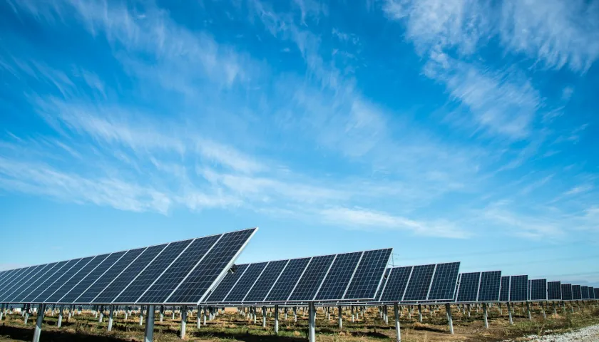 A solar and sensor installation in a green rural landscape.